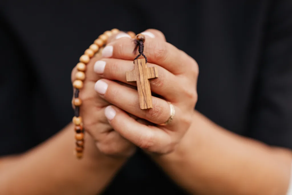 Prayer Request. Hands praying with the chaplet
